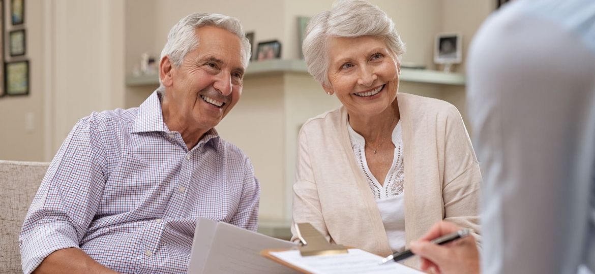 Senior couple meeting real estate agent at home. Old husband and